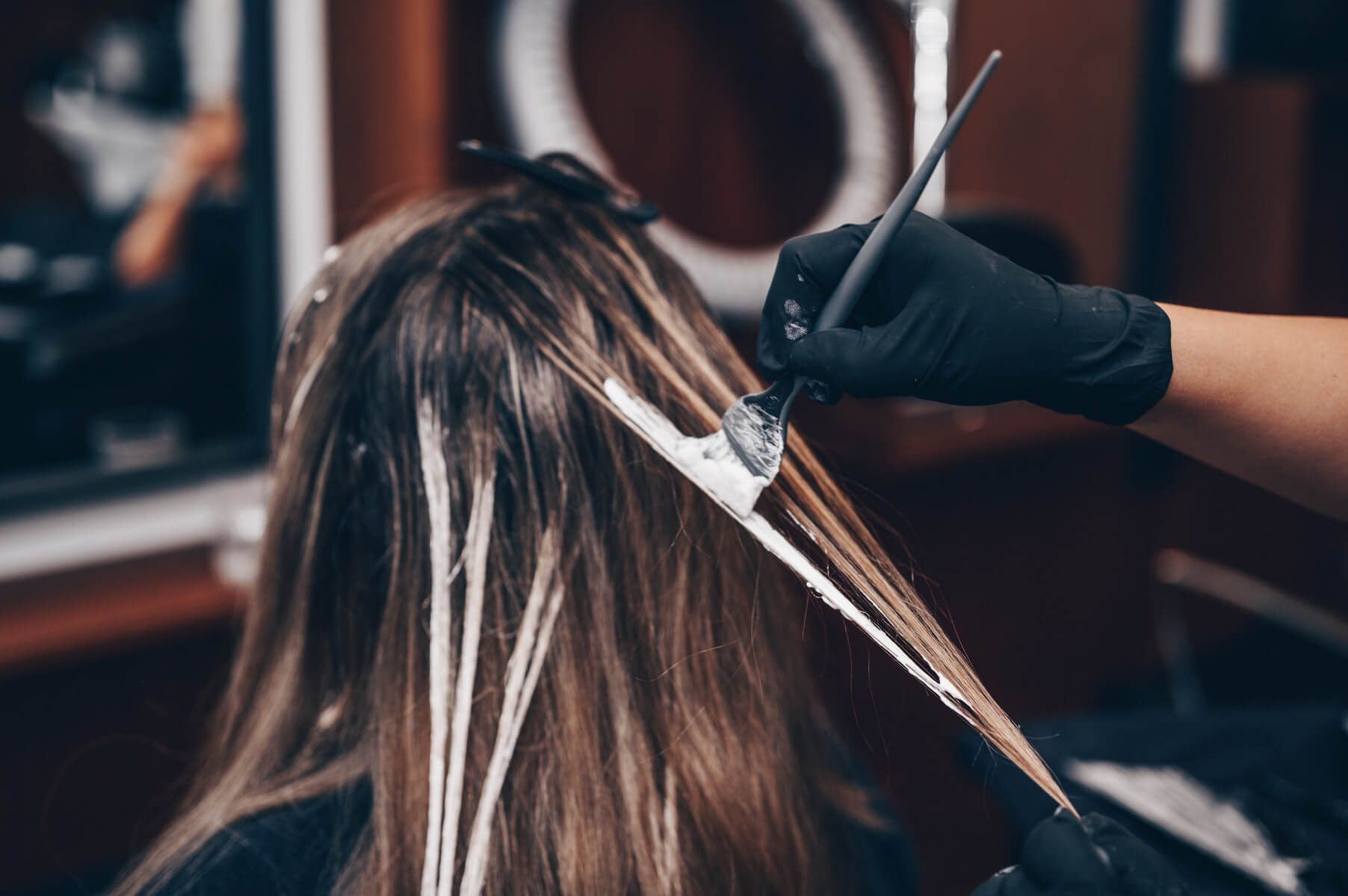 Colour being applied to a client’s hair
