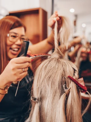 Melodie working on a client’s hair at Juicy Golden
