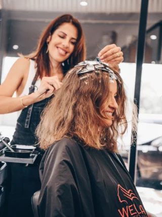 Santina applying colour foils at Juicy Golden
